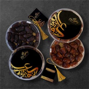 Ramadan date gift tubs with Safawi and Zamli dates in black and gold packaging.